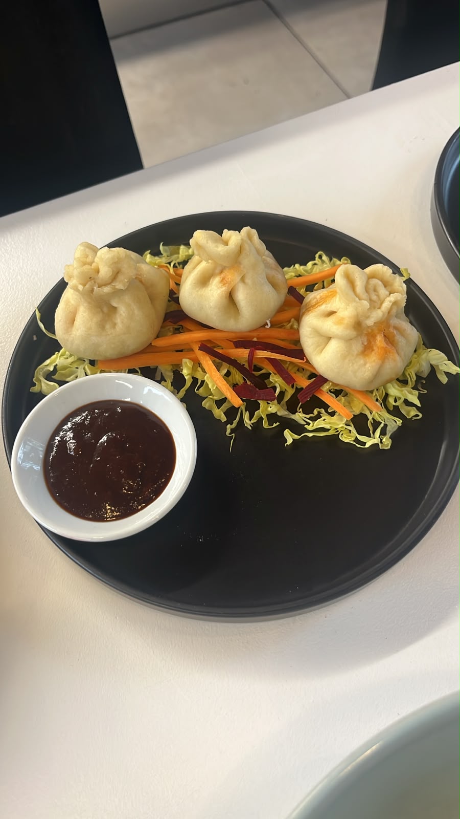 Dim sum with slaw and dipping sauce